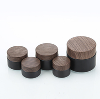 Ensemble d'emballages cosmétiques en verre noir mat en gros avec couvercle en bois, flacon pompe, pot à crème, flacon compte-gouttes pour sérum pour les soins de la peau