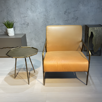 Fauteuil de loisirs individuel en fer forgé massif de style Mid-Century, avec revêtement en cuir ciré rétro et structure en métal forgé à la main