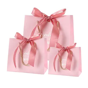 도매 주문 색깔 분홍색 선물 쇼핑 종이 선물 부대 다른 손잡이 유형을 가진 고품질 피복 부대
