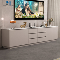 Meuble TV minimaliste moderne avec tiroirs de rangement, console multimédia au sol blanc crème à bords doux pour salon