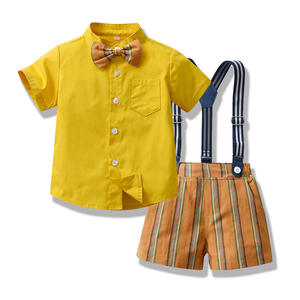 Conjunto de ropa de estilo moderno transfronterizo para niños mayores, <span class=keywords><strong>Camisa</strong></span> de algodón con lazo de manga corta de verano, conjunto de pantalones cortos a rayas con <span class=keywords><strong>tirantes</strong></span> - Product Image 1