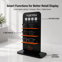 Présentoir vertical intelligent noir à 3 niveaux pour lunettes, avec étagères à accents orange, panneau arrière à motifs, empreinte compacte, pour comptoir