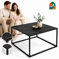Table basse moderne pour salon avec cadre carré en métal noir, plateau effet marbre anthracite et pieds cubes ouverts