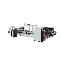 Machine entièrement automatique de collage et d'agrafage de cartons / Plioir-colleuse-agrafeuse pour boîtes en carton ondulé