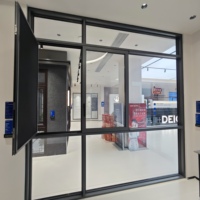 Porte coulissante Deioux en alliage d'aluminium noir, double vitrage Low-E, profil à rupture de pont thermique, insonorisée, design moderne et minimaliste