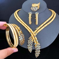 T436A Vente en gros d'usine, Nouveauté : Ensemble de bijoux exquis 4 pièces pour femme, motif fleur de lys africaine NAIJA, idéal pour mariage et rendez-vous, Dernière collection