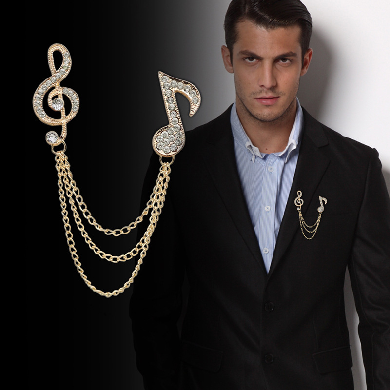 Spilla vintage a forma di nota musicale con strass neri e trasparentiVintage - Italia