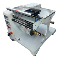 Enrouleur automatique pour machine à rouler le film plastique, machine à enrouler les étiquettes