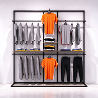 Portant à vêtements métallique robuste avec cadre noir, étagère en bois et tringle de suspension pour magasin de vêtements CE ETL Vente en gros