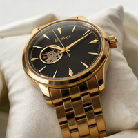 Montre automatique rétro à cadran noir brillant effet rayons de soleil, mouvement apparent, bracelet en acier inoxydable doré pour homme
