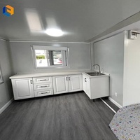 Maison conteneur extensible à double aile utilisée pour le transport de fournitures de secours et transformée en abris temporaires