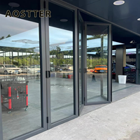 Porte pliante en aluminium AOSTTER à cadre noir robuste avec double vitrage isolant et verrouillage multipoints pour une utilisation haut de gamme dans les salles à manger