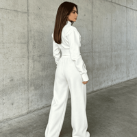 Ensemble de survêtement unisexe 2 pièces brodé pour l'automne, avec haut asymétrique à col montant et fermeture éclair, et pantalon large à ourlet fendu, style décontracté et sportif