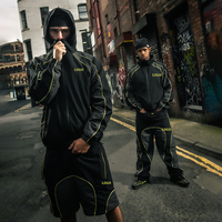 Conjunto Deportivo Personalizado con Ribete Reflectante, Chaqueta Cortavientos Ligera y Pantalones de Chándal con Diseño de Parches Sostenibles para Hombre
