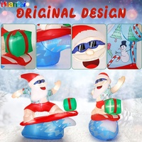 Noël gonflable surf père noël avec lumières LED promotion d'usine décoration gonflable adaptée à la pelouse de jardin