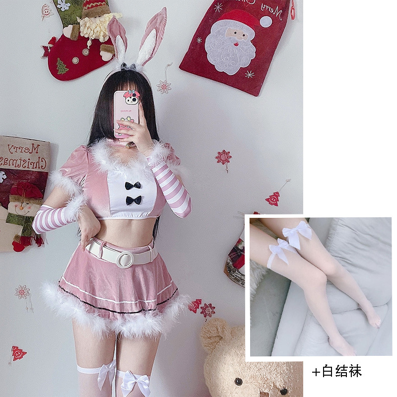Tenue de Noël rose avec bas blancs noués