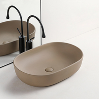 Lavabo ovale en céramique de qualité hôtelière OEM/ODM, effet granit, pour salle de bain de luxe, hôtel, villa