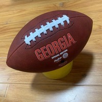 Logo personnalisé par le fabricant pour les jeux de rugby de divertissement, utilisant du cuir composite PU, ballon de rugby américain de taille officielle 9 en PU.