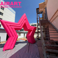 Arche gonflable étoile rose pour événements publicitaires et décorations. Arche gonflable étoile personnalisée pour événements en extérieur.