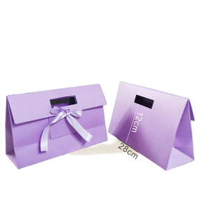 Bolsa de Papel Plegable Color Lavanda con Logotipo Personalizado, Lazo de Cinta, Asa Recortada y Tapa Abatible, Bolsa de Regalo para Ropa y Pequeños Obsequios - Product Image 1