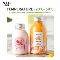 Bouteilles en plastique rondes personnalisées de qualité alimentaire pour la maison Bouteilles en plastique jetables pour boisson de jus avec couvercle
