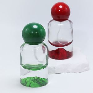 Bouteilles de parfum cylindriques en verre OEM/ODM 30ml 50ml 100ml avec fonds sérigraphiés or/argent/bleu/rouge/vert et pulvérisateur à pompe pour cadeau - Product Image 3