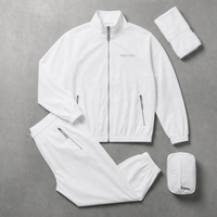 Ensemble de survêtement blanc pour homme, veste zippée en nylon froissé perforé découpé au laser avec passepoil argenté et pantalon de survêtement, personnalisable avec marque privée
