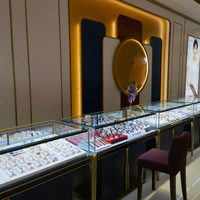 Vitrine personnalisée de bijoux en métal de Delux montre de luxe en or armoire en bois claire à LED boutique de luxe en verre vitrine