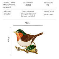 Ornement de Noël Robin en alliage de zinc, tête verte pailletée, poitrine orange, corps brun, émail, branche de houx veinée d'or, strass