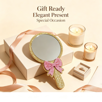 Miroir cosmétique portable à paillettes avec nœud rose et cadre doré, personnalisable avec logo, idéal pour cadeau promotionnel et ornement de bureau