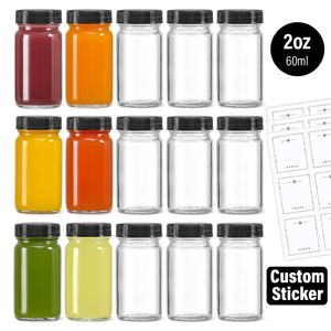 Venta al por mayor de botellas de muestra de 2oz 60ml transparentes tipo Ginger Jar, envases vacíos de vidrio para shots de jengibre con tapa de rosca negra - Product Image 1
