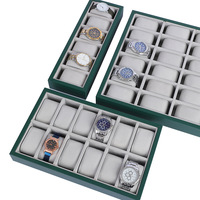 Présentoir à montres professionnel avec ce plateau de présentation en cuir vert émeraude à 24 emplacements de qualité supérieure