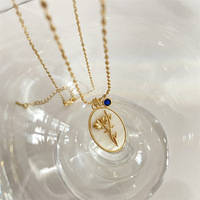 Design exquis collier de pierre de naissance plaqué or 18K pendentif ovale géométrique collier de fleur de naissance pour les femmes cadeau