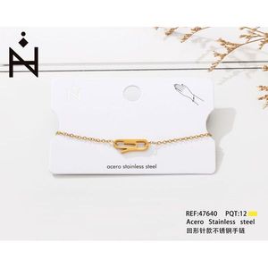 Bracciale in acciaio inossidabile stile graffetta, tono oro, design minimalista per donna, gioielli alla moda - Product Image 3