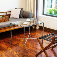Table basse ronde moderne géométrique martelée avec base en fonte et plateau en verre, lavable et durable, pour salon intérieur