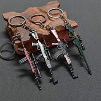 Vente en gros de 49 styles de mini-pistolets en alliage, porte-clés, modèles de pistolets de jeu, pendentifs, jouets cool pour garçons, accessoires pour sacs à dos, cadeaux d'anniversaire sûrs pour garçons