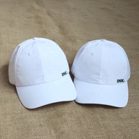 Vente en gros directe de casquettes de golf blanches pour femmes, à logo personnalisé imprimé, à visière incurvée, 6 panneaux, non structurées, avec trous découpés au laser