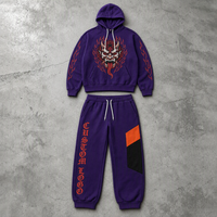 Ensemble deux pièces personnalisé pour homme : sweat à capuche violet avec motif démon flamboyant et pantalon de jogging à cordon avec poche color block OEM ODM