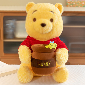 Venta al por mayor en Stock lindo amarillo sentado Winnied oso sosteniendo tarro de miel juguete de peluche dibujos animados Sleeppillow regalo de cumpleaños para niñas niños - Product Image 1
