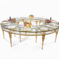 Table de banquet ronde de luxe en cristal avec base en grille dorée pour la location d'événements hôteliers