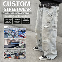 Jean baggy rayé pour homme, personnalisable OEM, avec poches plaquées et coupe large, en denim déchiré, idéal pour les marques de streetwear