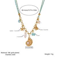 Collier de style côtier en acier inoxydable plaqué or PVD 18 carats avec breloque en corde tressée, coquillage, étoile de mer, perle et turquoise – Bijoux de plage