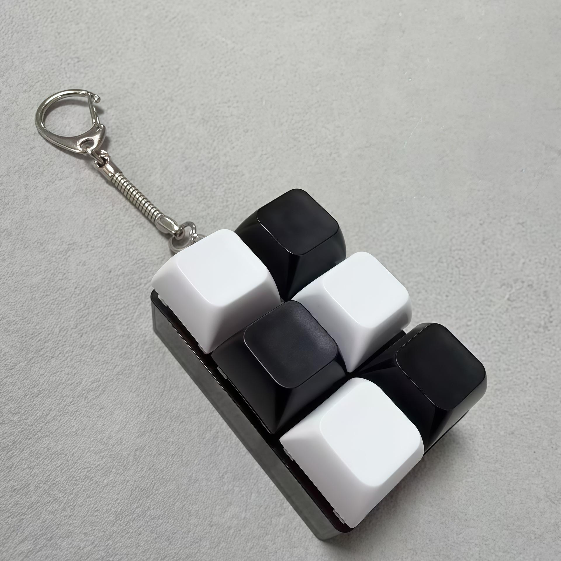 Boîtier transparent noir à 6 boutons avec capuchon noir et blanc