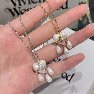 Collar y Pendientes de Perlas de Tres Gotas Saturno Versión Alta Western Queen Mother Vivienne, Joyería de Corazón con Borla Atrapasueños - Product Image 6