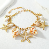 Collier, bracelet et boucles d'oreilles unisexes plaqués or, style bohème chic, avec breloques en forme de coquillage, étoile de mer et conque, pour la vente en gros