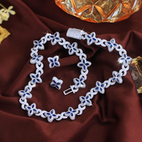 Parure de bijoux Hip Hop en saphir bleu, collier et boucles d'oreilles trèfle à quatre feuilles, chaîne cubaine en zircon cubique pour femme et homme