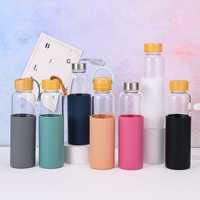 Bouteilles d'eau en verre borosilicate de haute qualité avec manchon en silicone, sans BPA, réutilisables, transparentes, avec couvercle en bambou anti-fuite