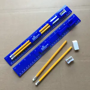 2 crayons, gomme et affûteur sur la règle. logo personnalisé pour la rentrée scolaire