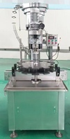 Machine de sertissage automatique de capsules à anneau HL-XGH01 pour les boissons gazeuses, les boissons, la bière, les bouteilles en verre avec un distributeur de capsules