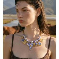 Collier élégant JINYOU 5881 avec pendentif cœur en céramique émaillée bleu et blanc, perles en céramique et acier inoxydable, et breloque animale en métal